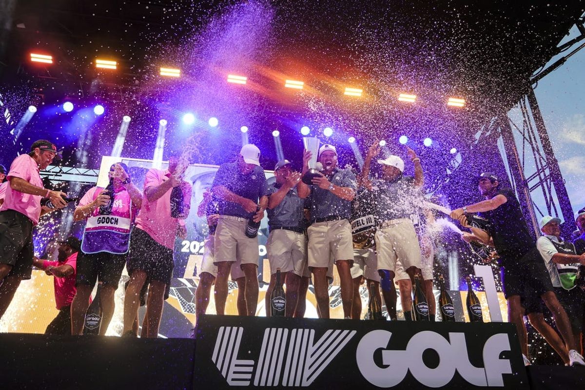 Oct 22, 2023; Doral, Florida, USA; Team Crushers GC captain Bryson Dechambeau celebrates with teammates Paul Casey, Charles Howell III and Anirban Lahiri, winning the team championship during the final round of the LIV Golf Miami golf tournament at Trump National Doral. Mandatory Credit: Sam Navarro-USA TODAY Sports