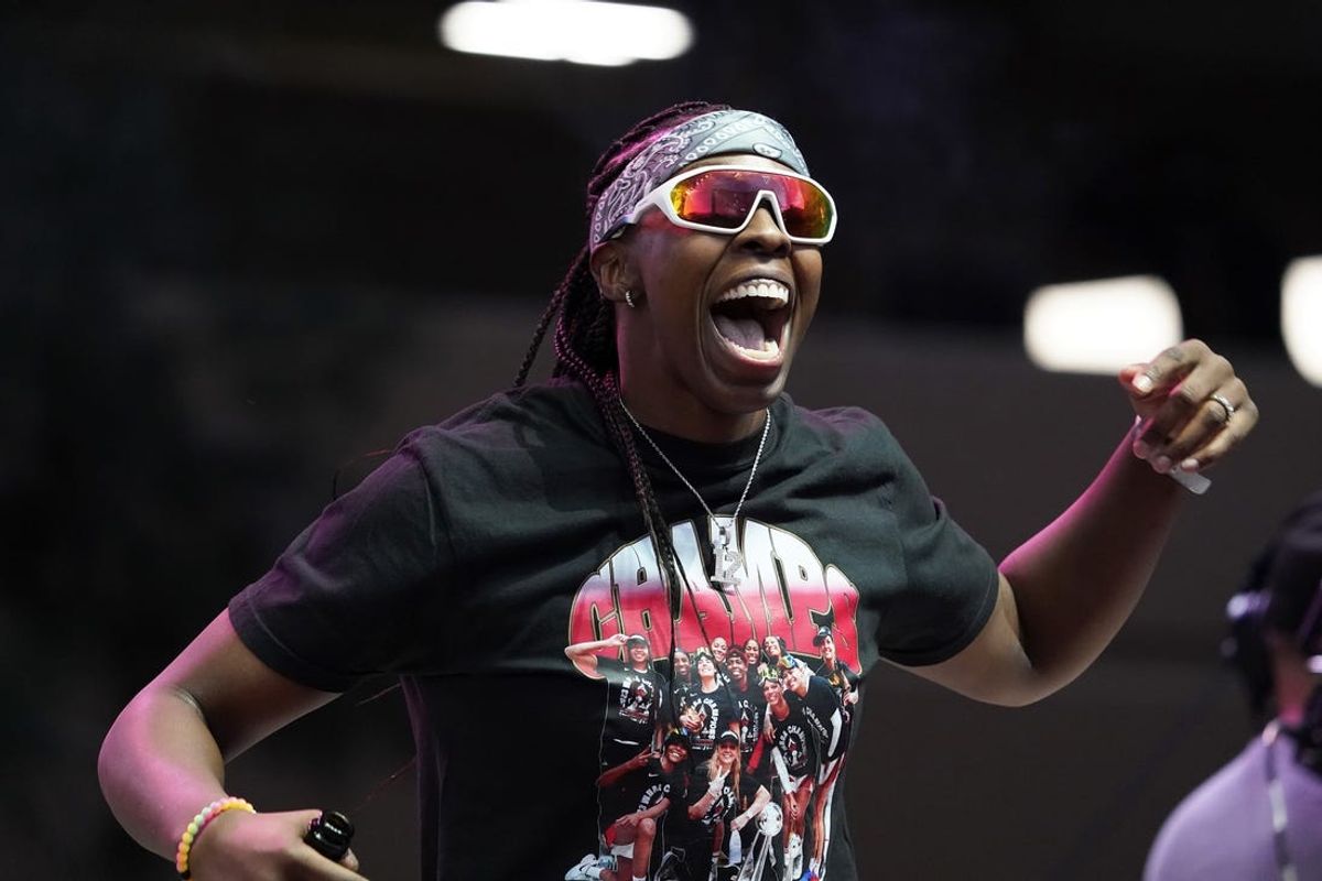 Oct 23, 2023; Las Vegas, NV, USA;  Las Vegas guard Chelsea Gray (12) celebrates during the Las Vegas Aces championship parade at Toshiba Plaza. Mandatory Credit: Lucas Peltier-USA TODAY Sports