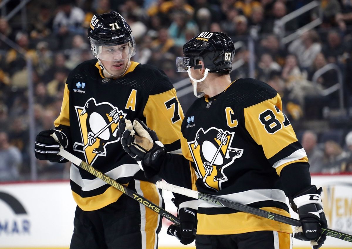 Oct 28, 2023; Pittsburgh, Pennsylvania, USA; Pittsburgh Penguins center Evgeni Malkin (71) listens to center Sidney Crosby (87) prior to a face-off against the Ottawa Senators during the first period at PPG Paints Arena. Mandatory Credit: Charles LeClaire-Imagn Images