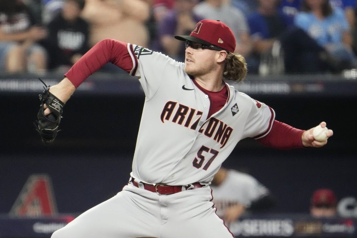 Arizona Diamondbacks relief pitcher Andrew Saalfrank (57) throws a pitch against the Texas Rangers during the eighth inning in game two of the 2023 World Series at Globe Life Field on Oct. 28, 2023, in Arlington, Texas.