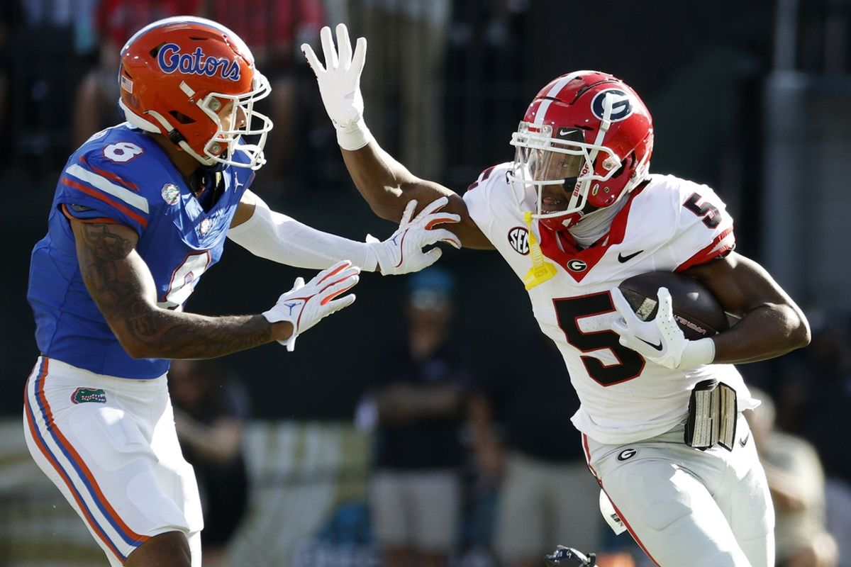 Oct 28, 2023; Jacksonville, Florida, USA; Georgia Bulldogs wide receiver Rara Thomas (5) runs against Florida Gators cornerback Jalen Kimber (8) in the first half at EverBank Stadium. Mandatory Credit: Jeff Swinger-Imagn Images