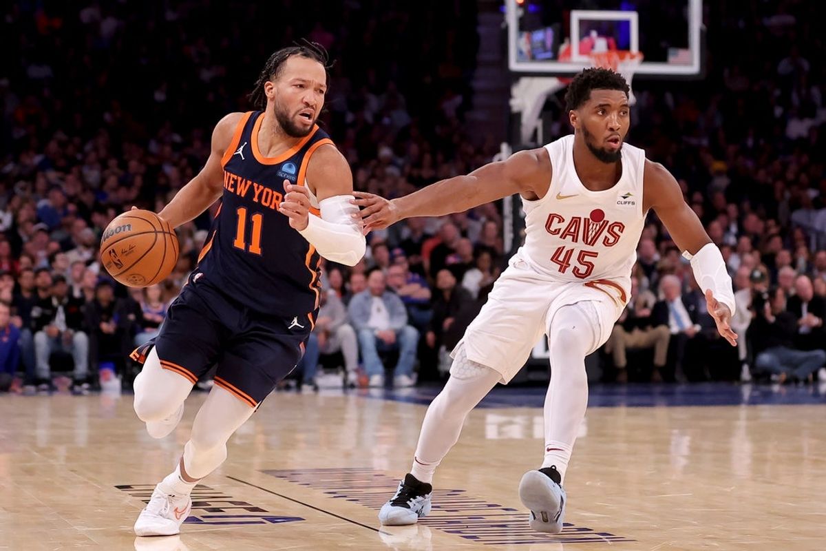 Nov 1, 2023; New York, New York, USA; New York Knicks guard Jalen Brunson (11) controls the ball against Cleveland Cavaliers guard Donovan Mitchell (45) during the fourth quarter at Madison Square Garden. Mandatory Credit: Brad Penner-Imagn Images