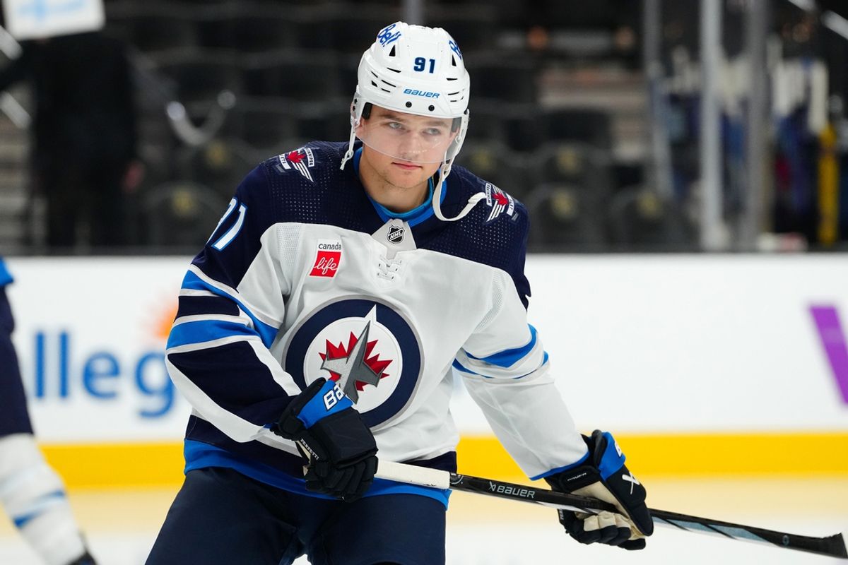 Nov 2, 2023; Las Vegas, Nevada, USA; Winnipeg Jets center Cole Perfetti (91) warms up before a game against the Vegas Golden Knights at T-Mobile Arena. Mandatory Credit: Stephen R. Sylvanie-Imagn Images