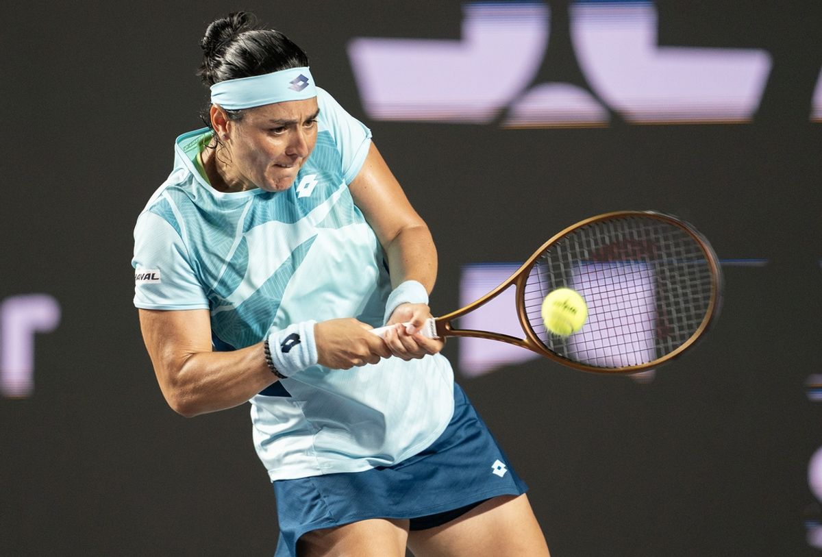 Nov 3, 2023; Cancun, Mexico; Ons Jabeur (TUN) returns a shot during her match against Iga Swiatek (POL) on day six of the GNP Saguaros WTA Finals Cancun. Mandatory Credit: Susan Mullane-Imagn Images