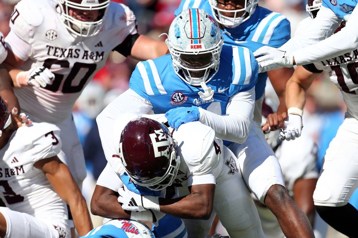 Nov 4, 2023; Oxford, Mississippi, USA; Mississippi Rebels defensive linemen Zxavian Harris (51) tackles Texas A&M Aggies running back Amari Daniels (4) during the second half at Vaught-Hemingway Stadium. Mandatory Credit: Petre Thomas-USA TODAY Sports