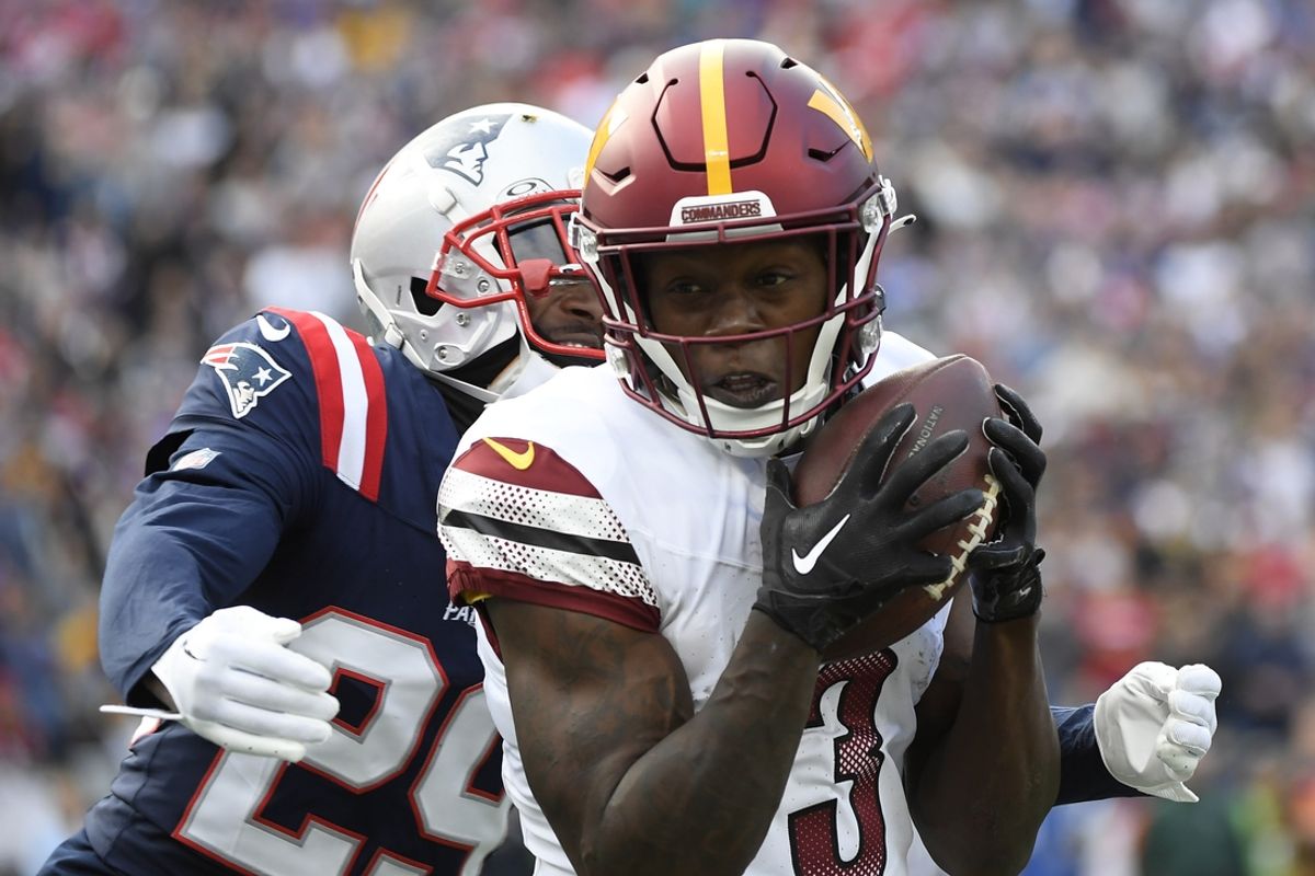 Nov 5, 2023; Foxborough, Massachusetts, USA;  Washington Commanders wide receiver Byron Pringle (3) catches a pass while New England Patriots cornerback J.C. Jackson (29) defends during the first half at Gillette Stadium. Mandatory Credit: Bob DeChiara-USA TODAY Sports