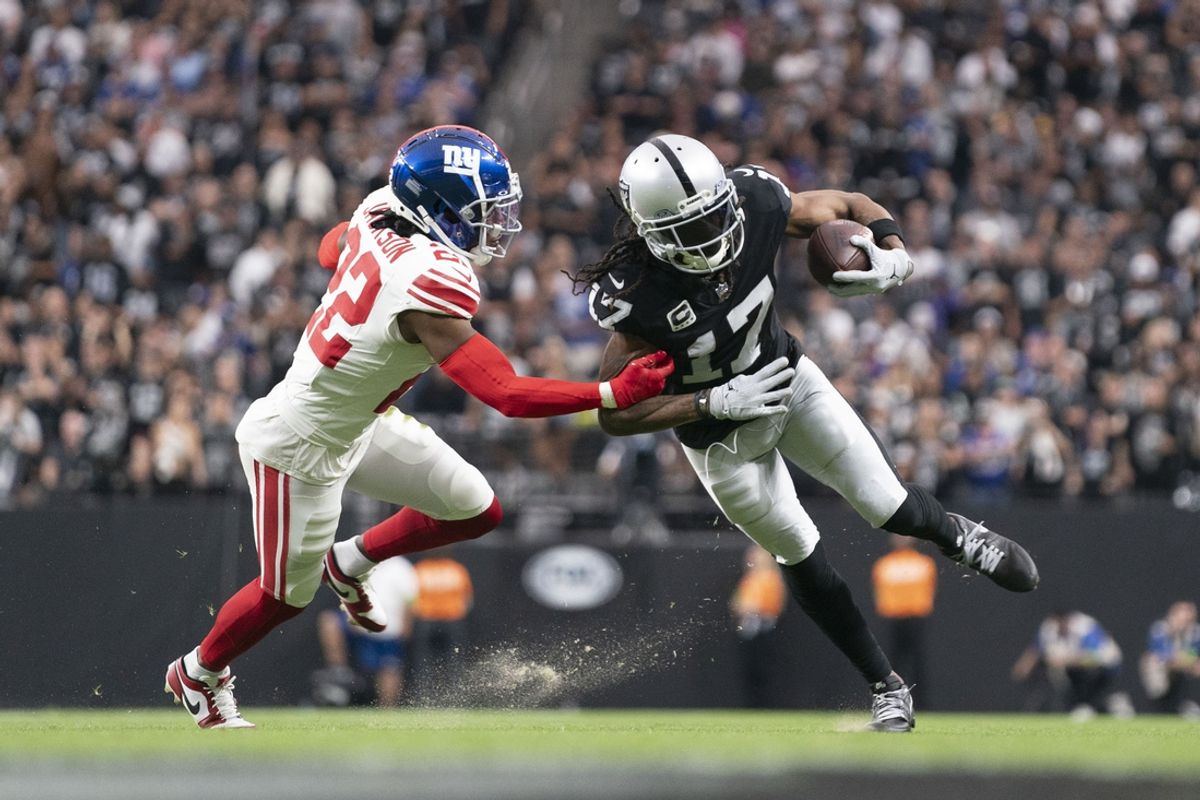 November 5, 2023; Paradise, Nevada, USA; Las Vegas Raiders wide receiver Davante Adams (17) runs the football against New York Giants cornerback Adoree' Jackson (22) during the second quarter at Allegiant Stadium. Mandatory Credit: Kyle Terada-Imagn Images