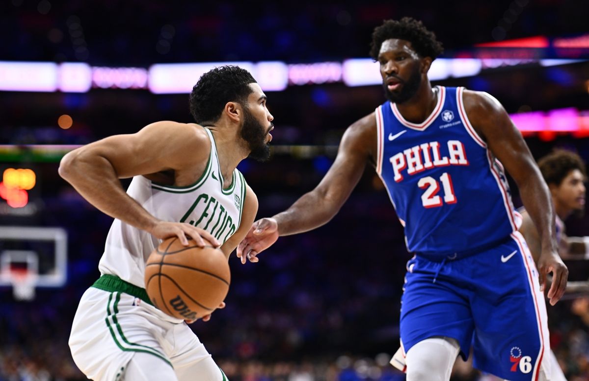 Nov 8, 2023; Philadelphia, Pennsylvania, USA; Boston Celtics forward Jayson Tatum (0) controls the ball against Philadelphia 76ers center Joel Embiid (21) in the first quarter at Wells Fargo Center. Mandatory Credit: Kyle Ross-Imagn Images