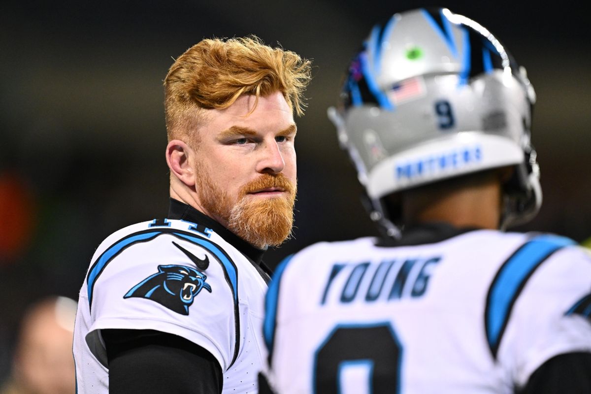 Nov 9, 2023; Chicago, Illinois, USA;  Carolina Panthers quarterback Andy Dalton (14) listens to quarterback Bryce Young (9) as they warm up before a game against the Chicago Bears at Soldier Field. Mandatory Credit: Jamie Sabau-Imagn Images