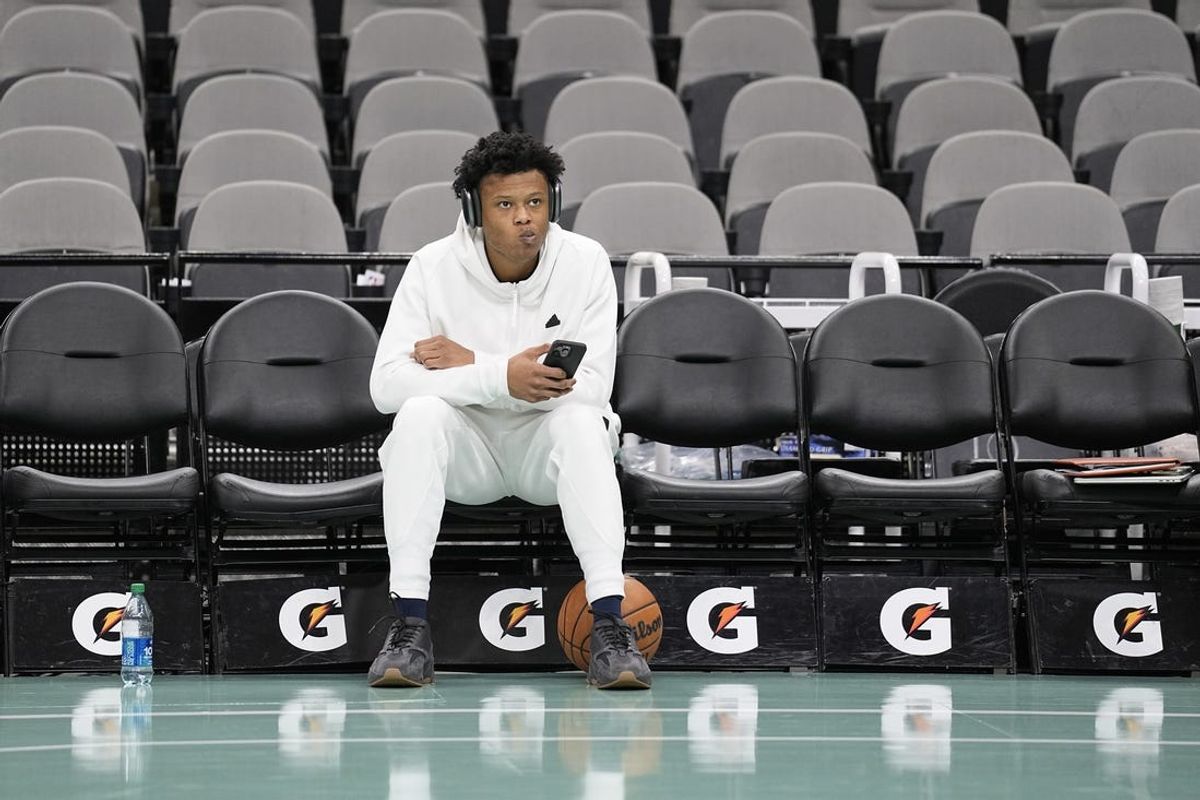 Nov 10, 2023; San Antonio, Texas, USA; Minnesota Timberwolves guard Jaylen Clark (0) sits on the bench before warming up for game against the San Antonio Spurs. Mandatory Credit: Scott Wachter-USA TODAY Sports