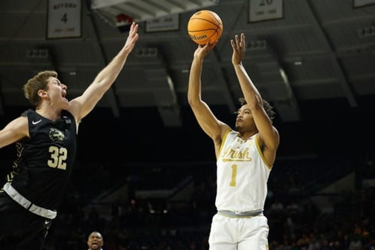 Notre Dame guard Julian Roper II (1) shoots the ball as Western Carolina forward Colin Granger (32) defends during the Western Carolina-Notre Dame NCAA Men   s basketball game on Saturday, November 11, 2023, at Purcell Pavilion in South Bend, Indiana.