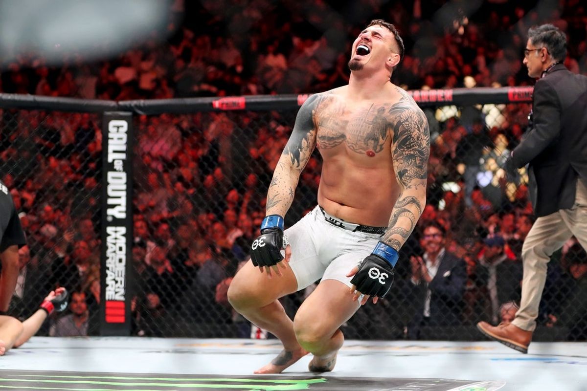 Nov 11, 2023; New York, NY, USA; Tom Aspinall (blue gloves) reacts to beating Sergei Pavlovich (red gloves) during UFC 295 at Madison Square Garden. Mandatory Credit: Wendell Cruz-Imagn Images