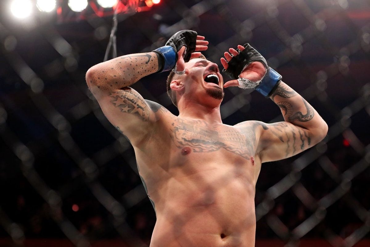Nov 11, 2023; New York, NY, USA; Tom Aspinall (blue gloves) reacts to beating Sergei Pavlovich (red gloves) during UFC 295 at Madison Square Garden. Mandatory Credit: Wendell Cruz-Imagn Images