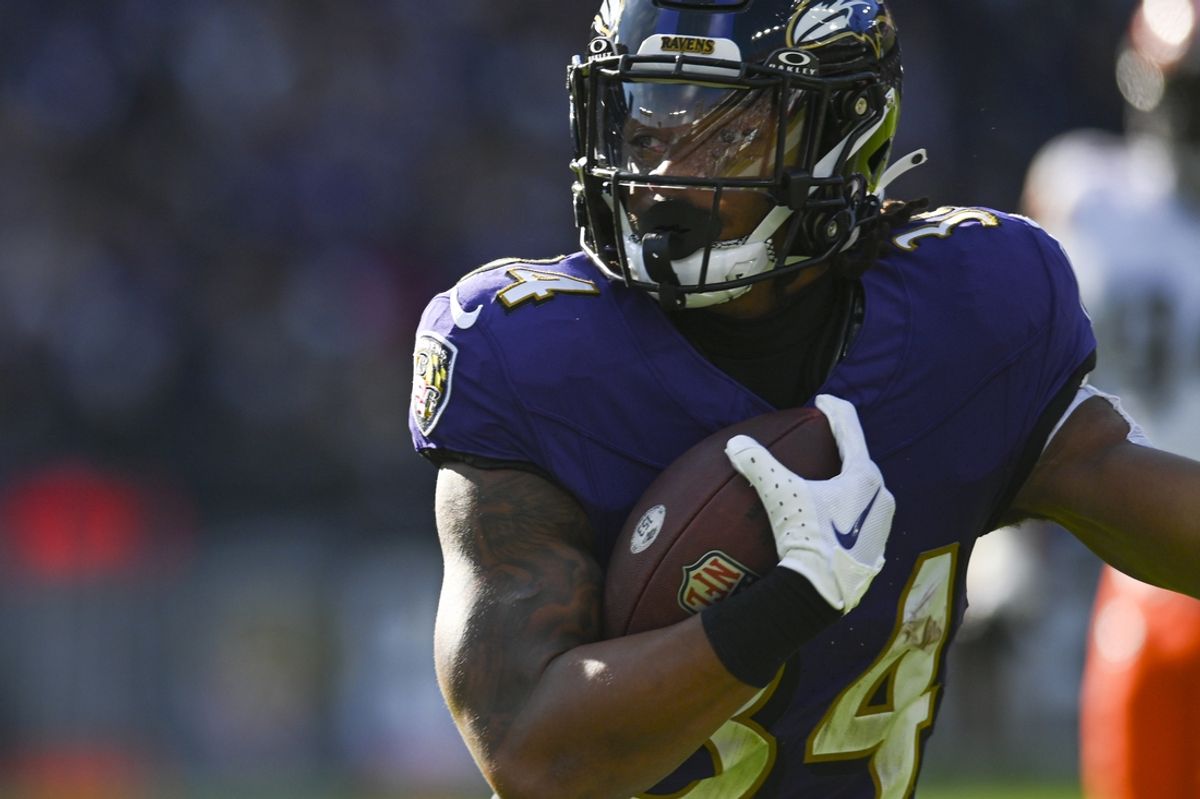Nov 12, 2023; Baltimore, Maryland, USA; Baltimore Ravens running back Keaton Mitchell (34) rushes during the first half against the Cleveland Browns  at M&T Bank Stadium. Mandatory Credit: Tommy Gilligan-Imagn Images