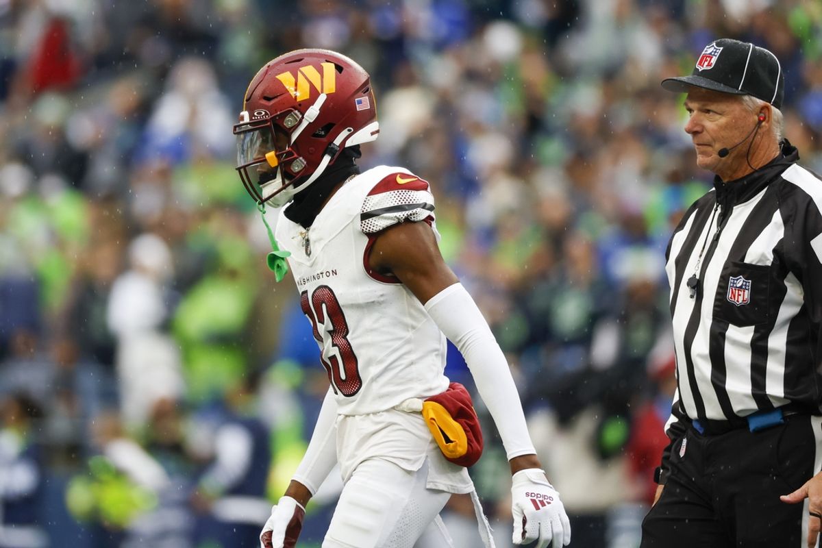 Nov 12, 2023; Seattle, Washington, USA; Washington Commanders cornerback Emmanuel Forbes (13) reacts after being ejected for a personal foul during the first quarter at Lumen Field. Mandatory Credit: Joe Nicholson-Imagn Images