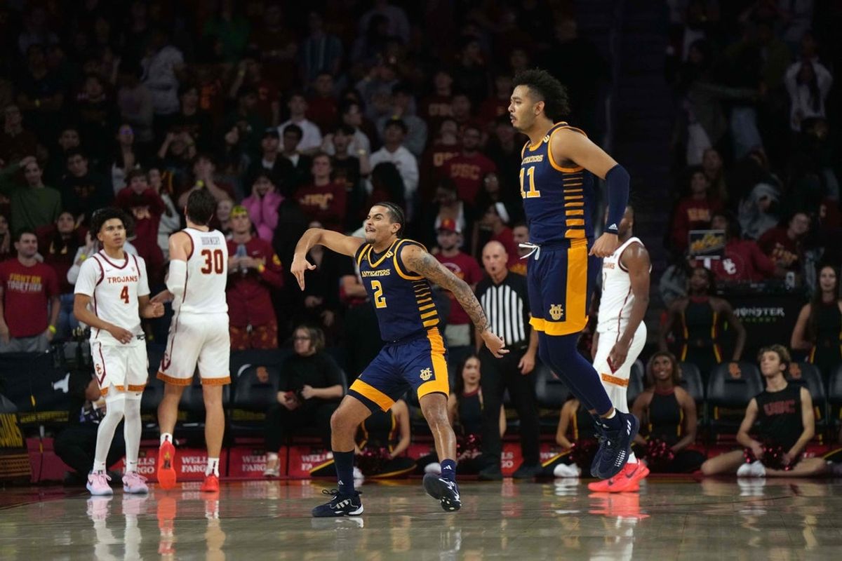 Nov 14, 2023; Los Angeles, California, USA; UC Irvine Anteaters guard Justin Hohn (2)and forward Devin Tillis (11) celebrate against the Southern California Trojans in the second half at Galen Center. Mandatory Credit: Kirby Lee-Imagn Images