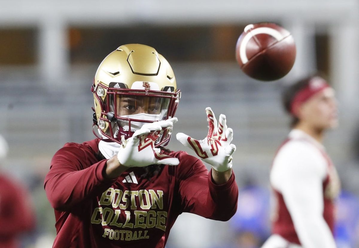 Nov 16, 2023; Pittsburgh, Pennsylvania, USA; Boston College Eagles wide receiver Dino Tomlin (13) warms up before the game against the Pittsburgh Panthers at Acrisure Stadium. Mandatory Credit: Charles LeClaire-Imagn Images