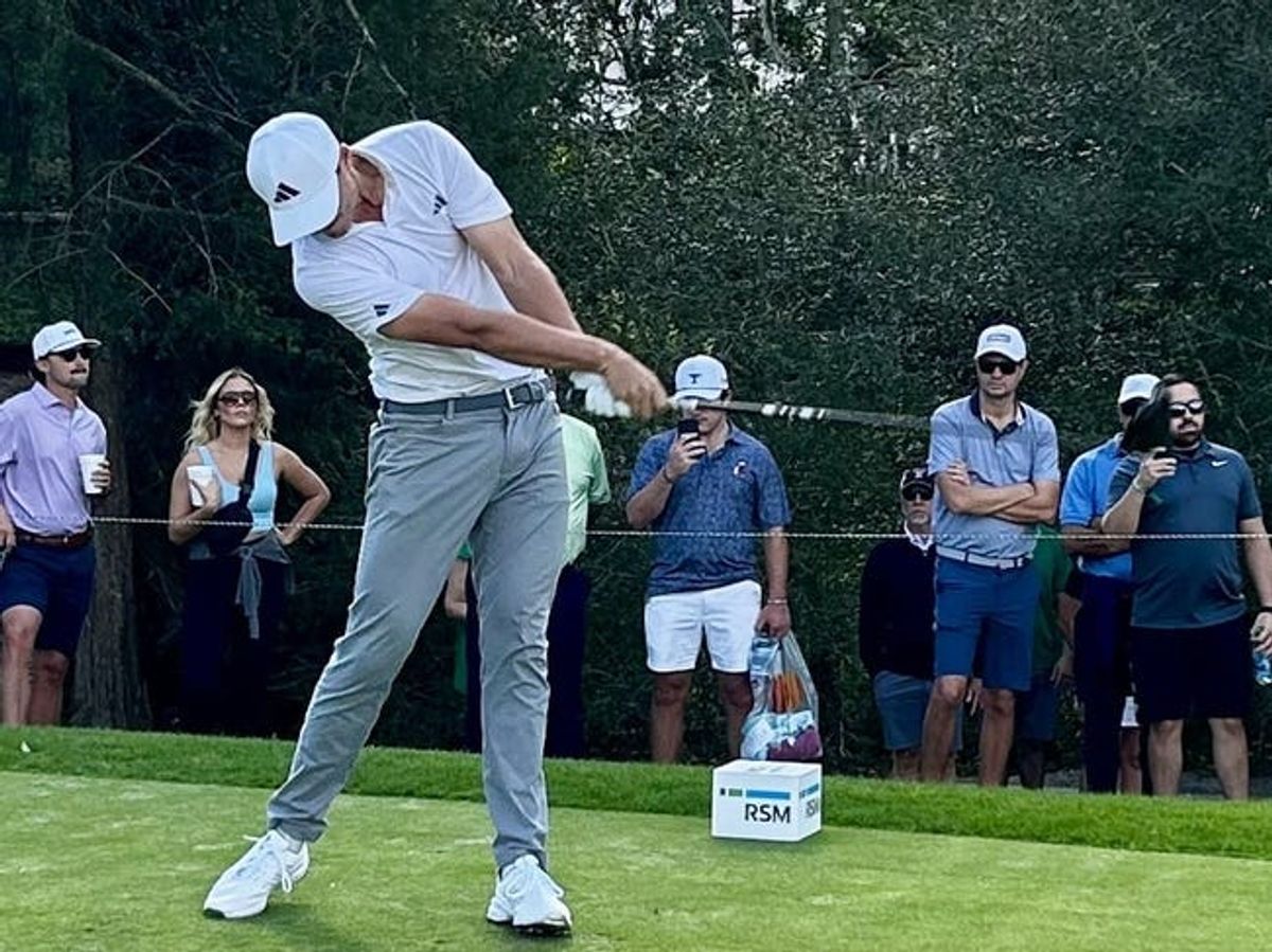 Ludvig Aberg of Sweden follows through on his drive at the 10th tee of the Sea Island Club Seaside Course on Saturday in the third round of the RSM Classic. Aberg leads by one shot over Eric Cole.