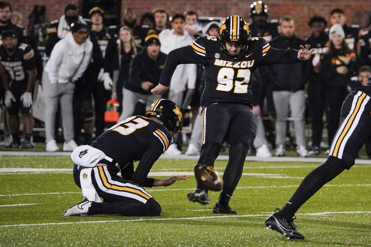 Nov 18, 2023; Columbia, Missouri, USA; Missouri Tigers place kicker Harrison Mevis (92) kicks the winning field goal against the Florida Gators during the second half at Faurot Field at Memorial Stadium. Mandatory Credit: Denny Medley-Imagn Images