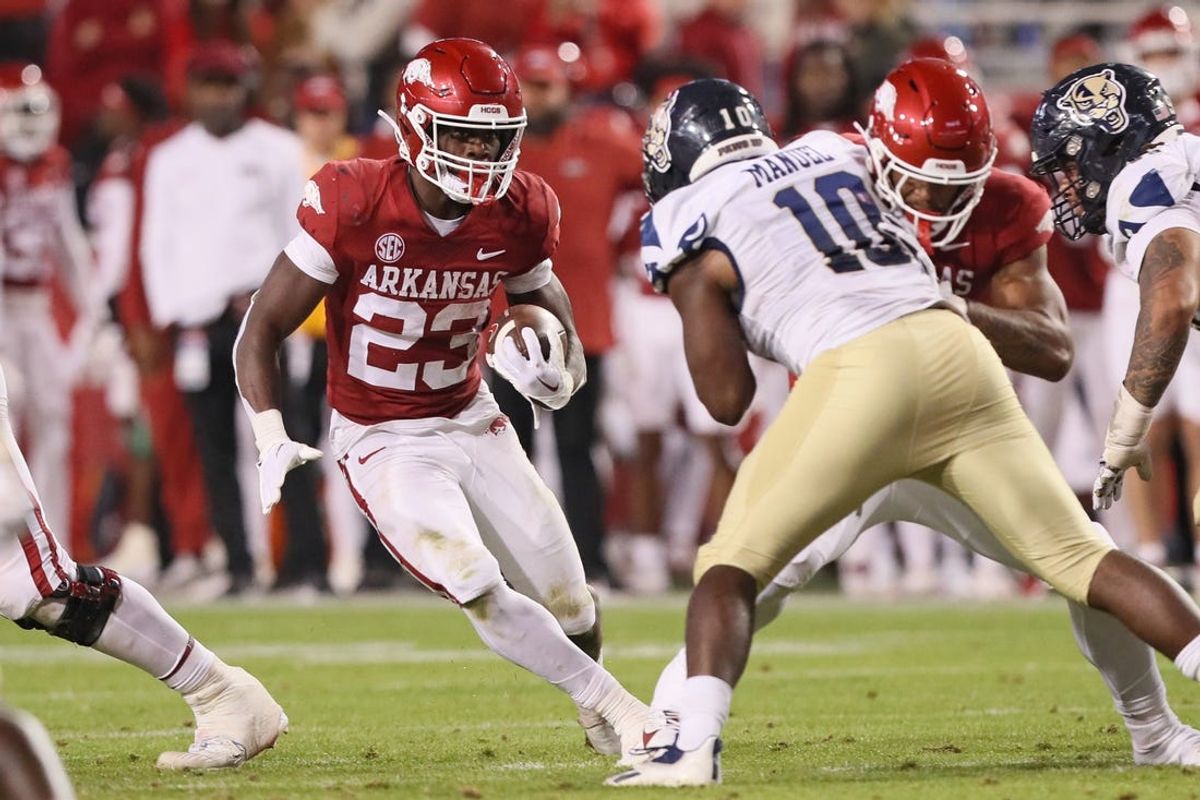 Nov 18, 2023; Fayetteville, Arkansas, USA; Arkansas Razorbacks running back Isaiah Augustave (23) rushes during the second half against the FIU Panthers at Donald W. Reynolds Razorback Stadium. Arkansas won 44-20. Mandatory Credit: Nelson Chenault-USA TODAY Sports