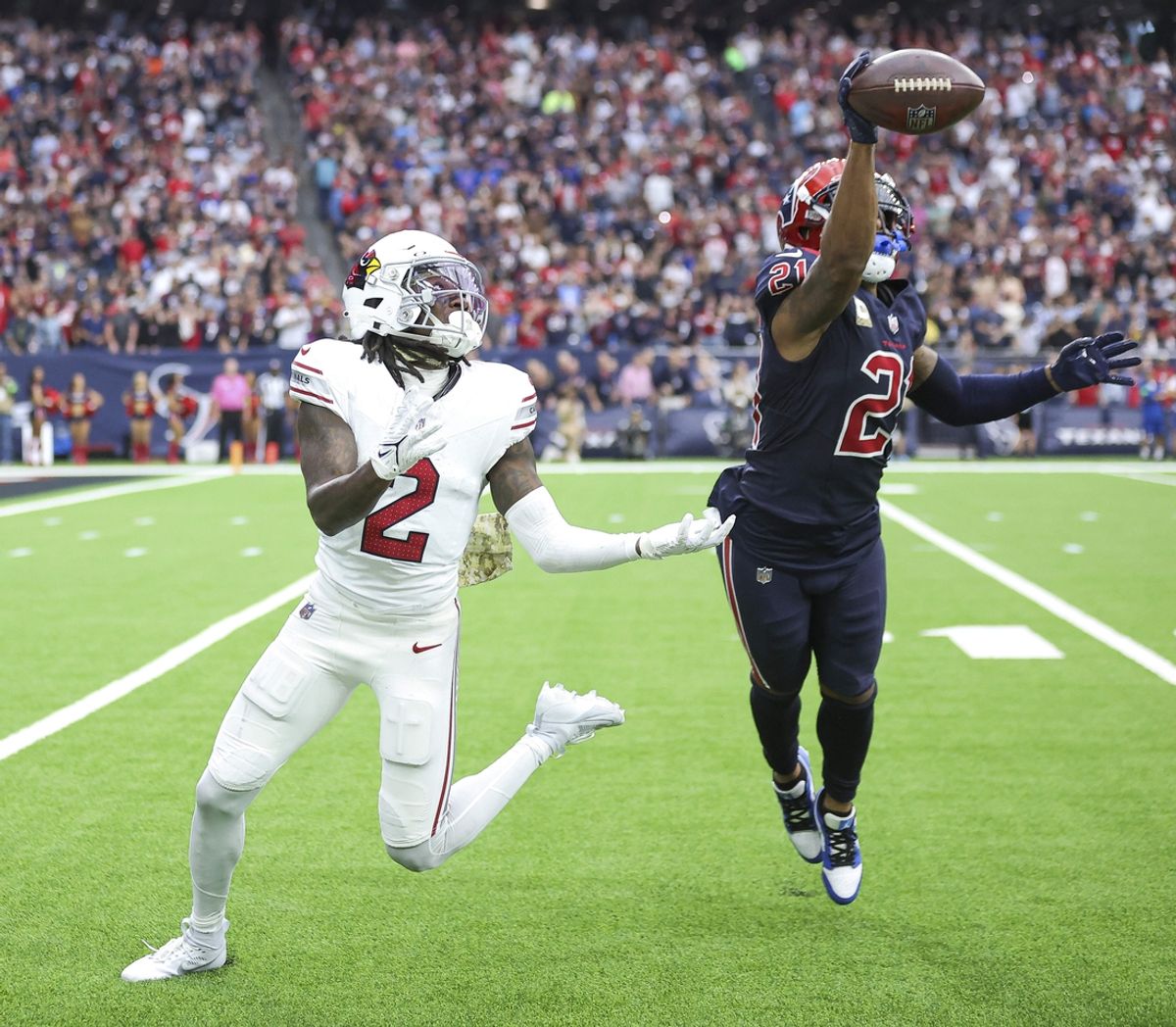 Nov 19, 2023; Houston, Texas, USA; Houston Texans cornerback Steven Nelson (21) deflects a pass intended for Arizona Cardinals wide receiver Marquise Brown (2) during the fourth quarter at NRG Stadium. Mandatory Credit: Troy Taormina-USA TODAY Sports