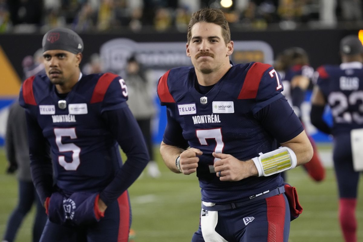 Nov 19, 2023; Hamilton, Ontario, CAN; Montreal Alouettes quarterback Caleb Evans (5) and Montreal Alouettes quarterback Cody Fajardo (7) during warm up before the game against the Winnipeg Blue Bombers  at Tim Hortons Field. Mandatory Credit: John E. Sokolowski-USA TODAY Sports
