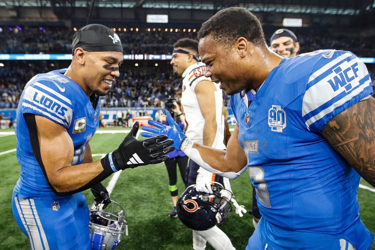 Detroit Lions wide receiver Amon-Ra St. Brown and running back David Montgomery celebrate the 31-26 win over the Chicago Bears at Ford Field in Detroit on Sunday, Nov. 19, 2023.