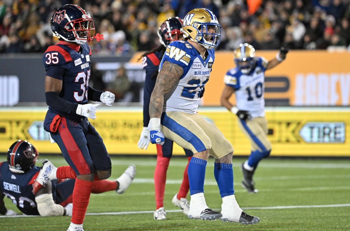 Nov 19, 2023; Hamilton, Ontario, CAN;  Winnipeg Blue Bombers running back Brady Oliveira (20) celebrates after scoring a touchdown past Montreal Alouettes defensive back Reggie Stubblefield (35) in the first half at Tim Hortons Field. Mandatory Credit: Dan Hamilton-Imagn Images