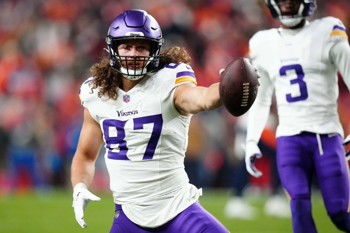 Nov 19, 2023; Denver, Colorado, USA; Minnesota Vikings tight end T.J. Hockenson (87) reacts after making a catch against the Denver Broncos in the first half at Empower Field at Mile High. Mandatory Credit: Ron Chenoy-Imagn Images
