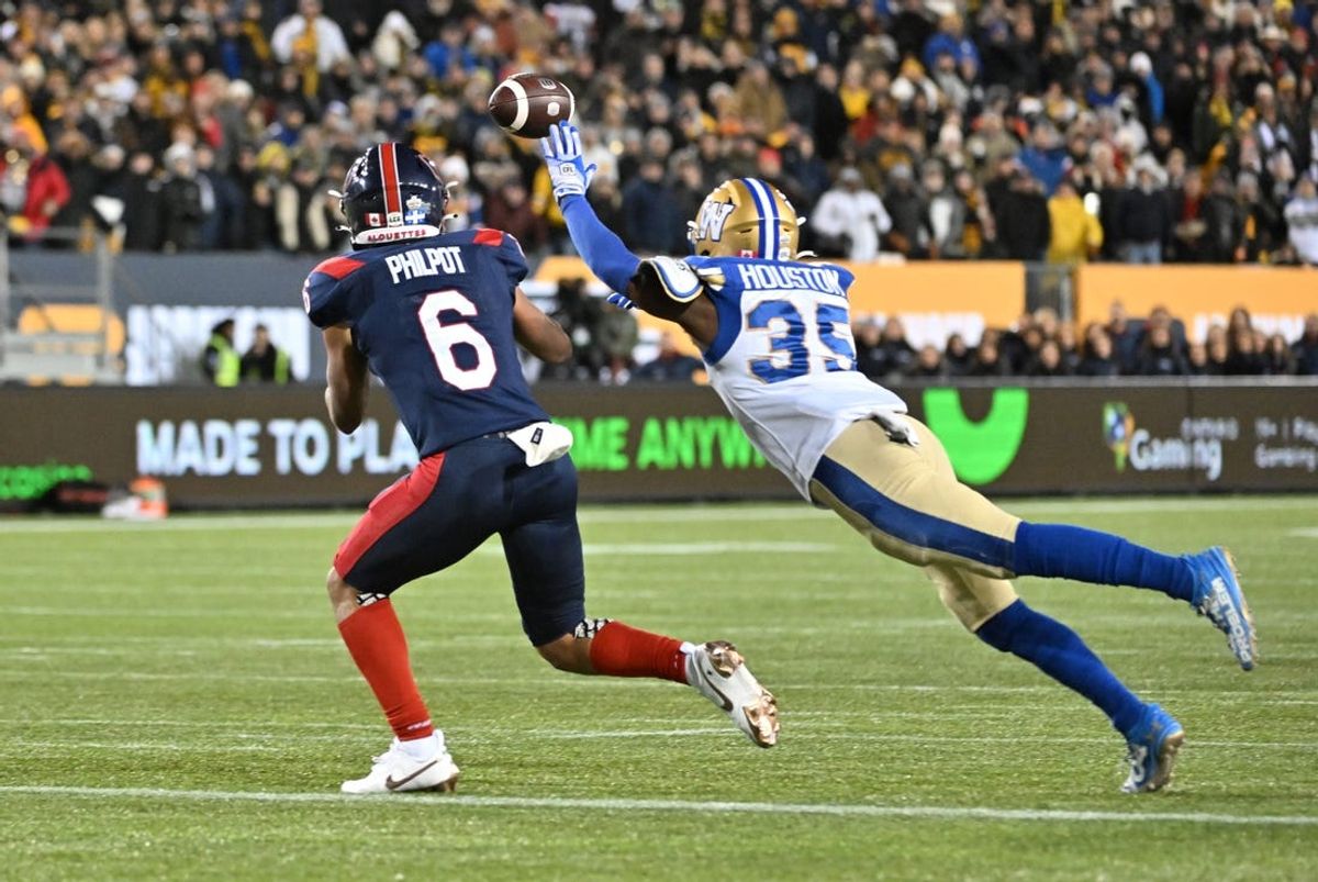 Nov 19, 2023; Hamilton, Ontario, CAN;  Montreal Alouettes wide receiver Tyson Philpot (6) catches the game-winning touchdown pass with 13 seconds left against Winnipeg Blue Bombers defensive back Demerio Houston (35) in the second half at Tim Hortons Field. Mandatory Credit: Dan Hamilton-USA TODAY Sports