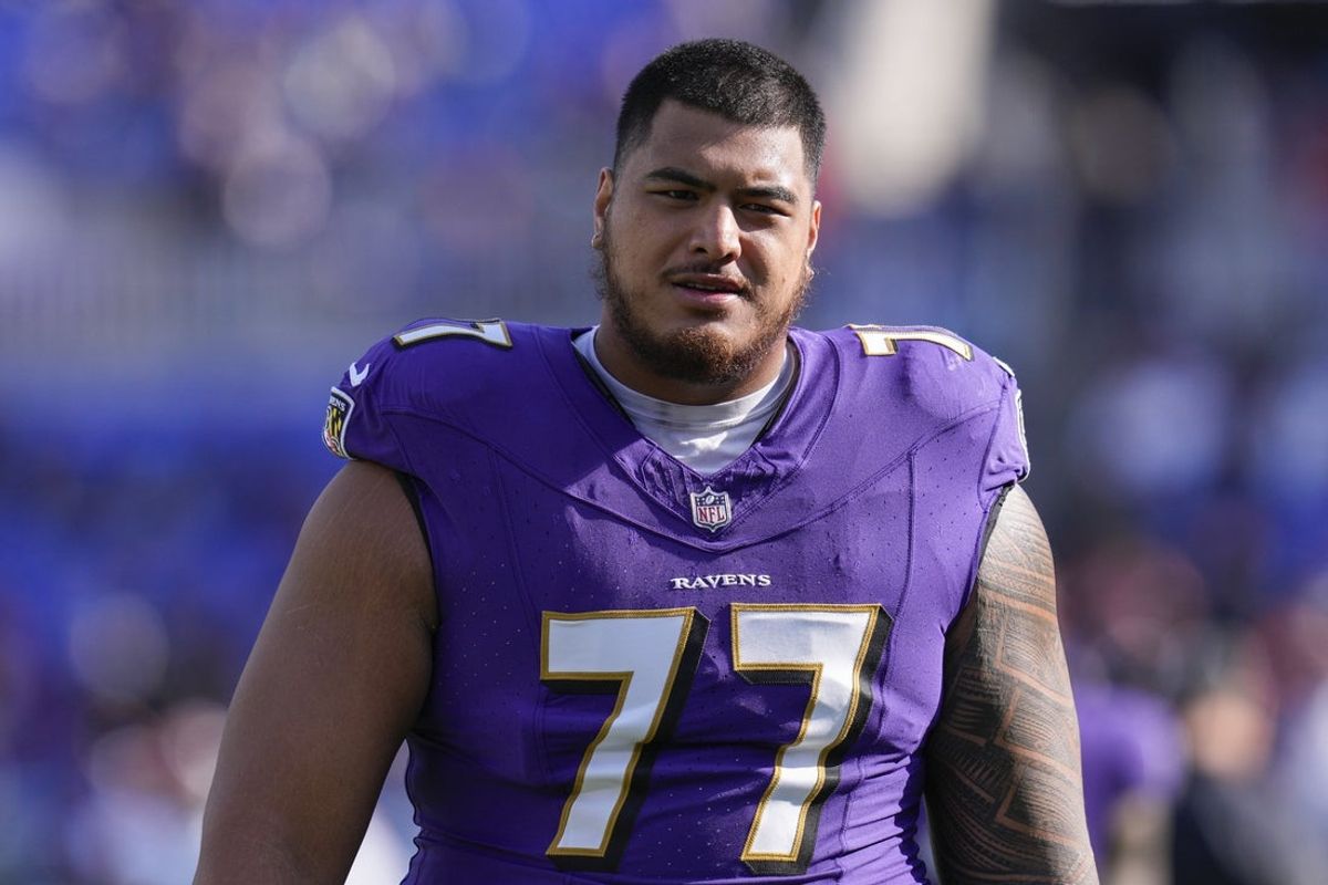 Nov 12, 2023; Baltimore, Maryland, USA;  Baltimore Ravens offensive tackle Daniel Faalele (77) looks on before a game against the Cleveland Browns at M&T Bank Stadium. Mandatory Credit: Jessica Rapfogel-Imagn Images