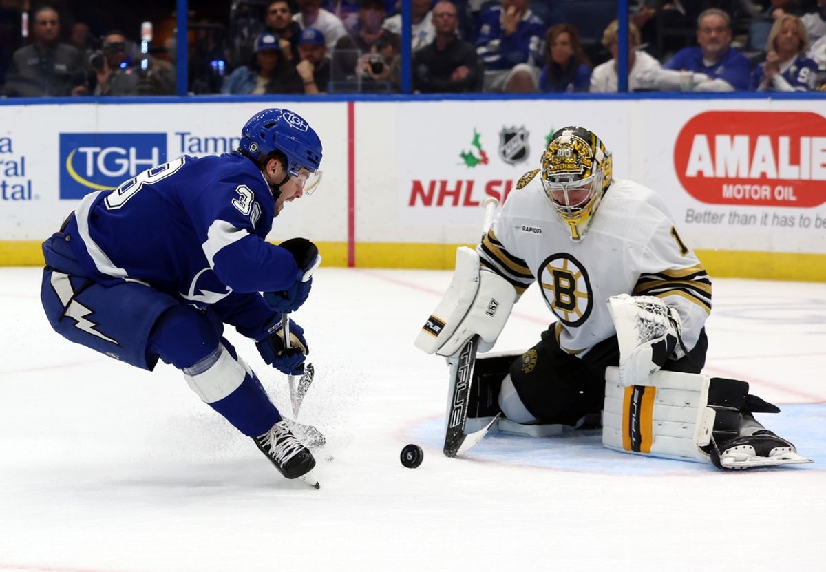 Nov 20, 2023; Tampa, Florida, USA; Tampa Bay Lightning left wing Brandon Hagel (38) skates with puck as Boston Bruins goaltender Jeremy Swayman (1) defends during the first period at Amalie Arena. Mandatory Credit: Kim Klement Neitzel-Imagn Images