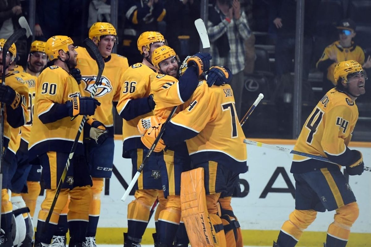 Mar 26, 2024; Nashville, Tennessee, USA; Nashville Predators left wing Jason Zucker (16) celebrates with goaltender Juuse Saros (74) after an overtime win against the Vegas Golden Knights at Bridgestone Arena.