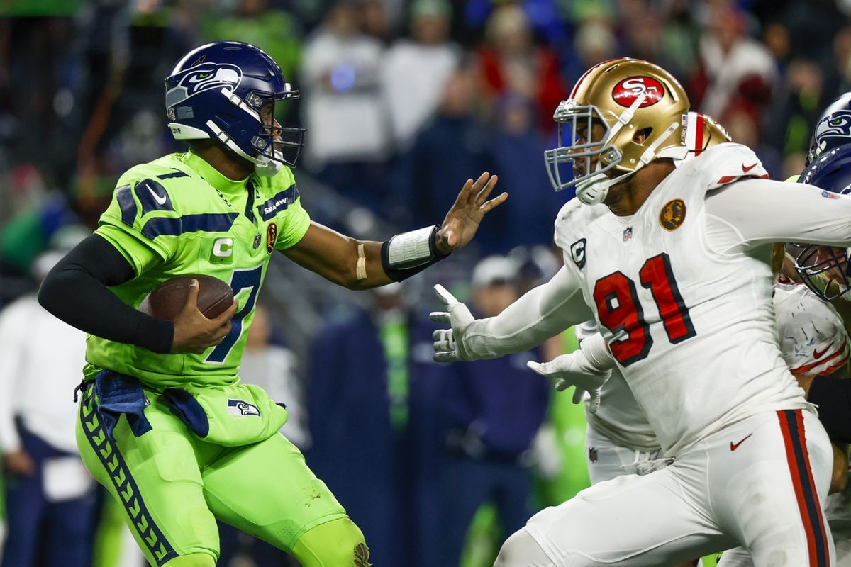 Nov 23, 2023; Seattle, Washington, USA; San Francisco 49ers defensive end Arik Armstead (91) sacks Seattle Seahawks quarterback Geno Smith (7) during the fourth quarter at Lumen Field. Mandatory Credit: Joe Nicholson-Imagn Images