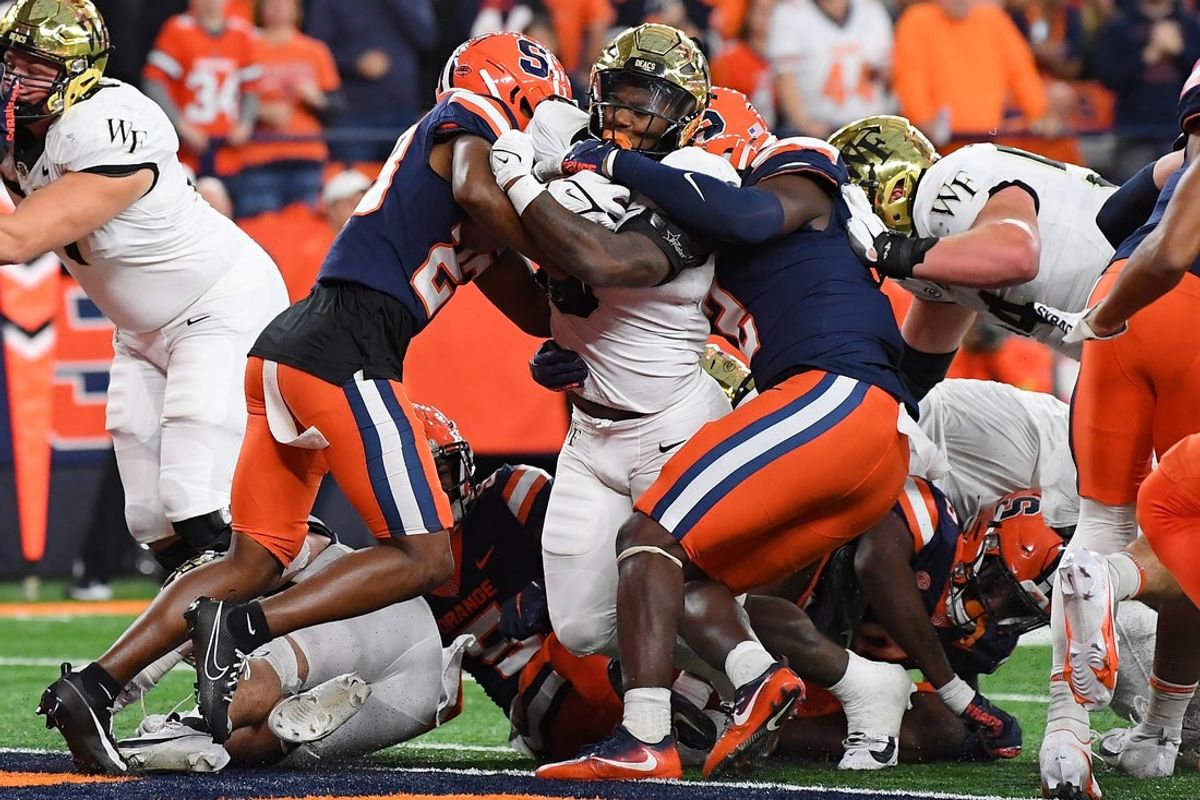 Nov 25, 2023; Syracuse, New York, USA; Wake Forest Demon Deacons running back Justice Ellison (6) runs into the end zone for a touchdown against the Syracuse Orange during the second half at the JMA Wireless Dome. Mandatory Credit: Rich Barnes-Imagn Images