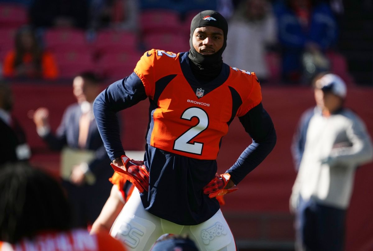 Nov 26, 2023; Denver, Colorado, USA;  Denver Broncos cornerback Pat Surtain II (2) stretches before the game against the Cleveland Browns at Empower Field at Mile High. Mandatory Credit: Ron Chenoy-Imagn Images