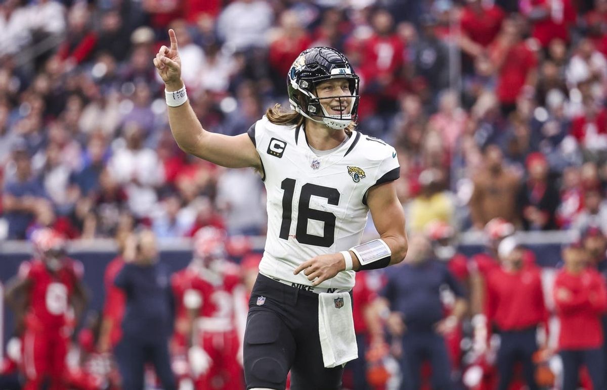 Nov 26, 2023; Houston, Texas, USA; Jacksonville Jaguars quarterback Trevor Lawrence (16) reacts after a two-point conversion during the third quarter against the Houston Texans at NRG Stadium. Mandatory Credit: Troy Taormina-USA TODAY Sports