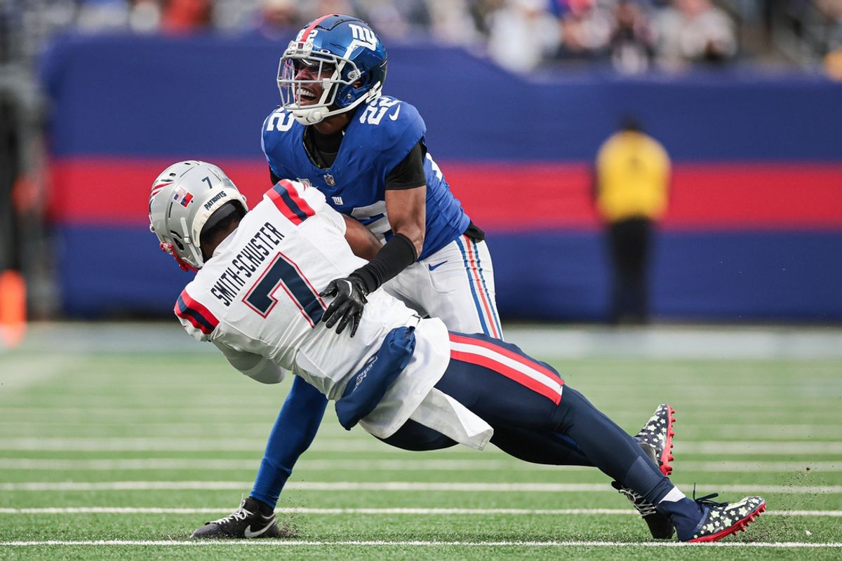 Nov 26, 2023; East Rutherford, New Jersey, USA; New England Patriots wide receiver JuJu Smith-Schuster (7) is tackled by New York Giants cornerback Adoree' Jackson (22) during the second half at MetLife Stadium. Mandatory Credit: Vincent Carchietta-USA TODAY Sports