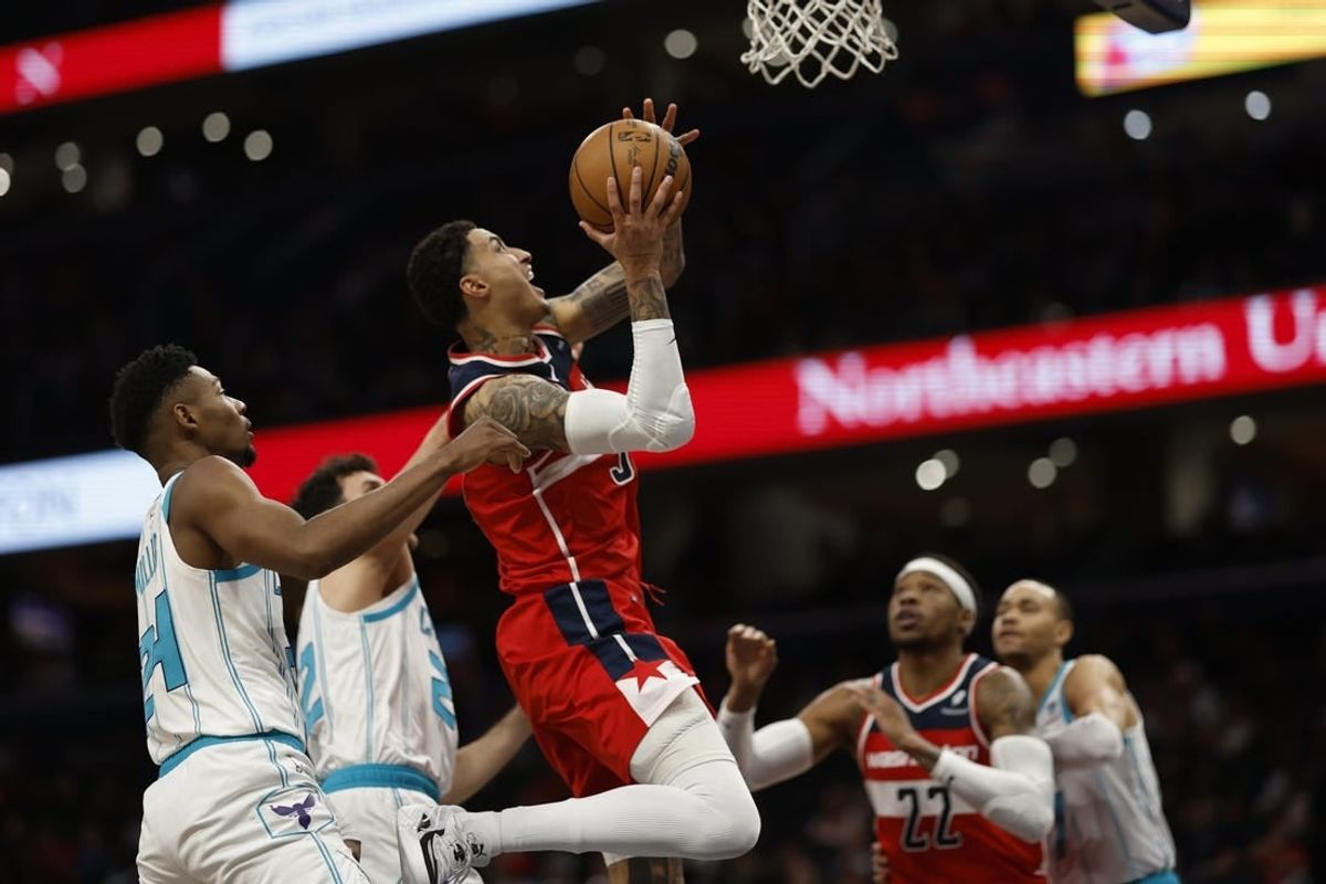 Mar 8, 2024; Washington, District of Columbia, USA;  Washington Wizards forward Kyle Kuzma (33) shoots the ball while being fouled by Charlotte Hornets forward Brandon Miller (24) in the first halfat Capital One Arena.
