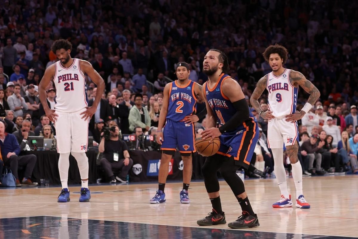 Apr 30, 2024; New York, New York, USA; New York Knicks guard Jalen Brunson (11) shoots a technical foul shot after a flagrant foul by Philadelphia 76ers center Joel Embiid (21) during overtime in game 5 of the first round of the 2024 NBA playoffs at Madison Square Garden.