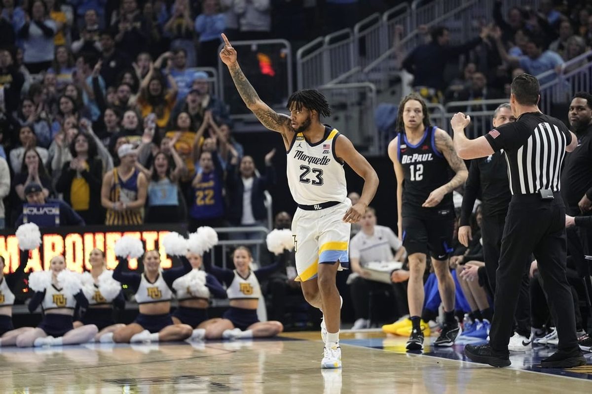 Feb 21, 2024; Milwaukee, Wisconsin, USA;  Marquette Golden Eagles forward David Joplin (23) celebrates after scoring a basket during the first half against the DePaul Blue Demons at Fiserv Forum.