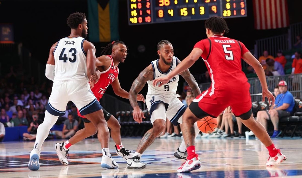 Nov 22, 2023; Paradise Island, BAHAMAS;  Villanova Wildcats guard Justin Moore (5) controls the ball as Texas Tech Red Raiders guard Darrion Williams (5) defends during the first half at Imperial Arena.