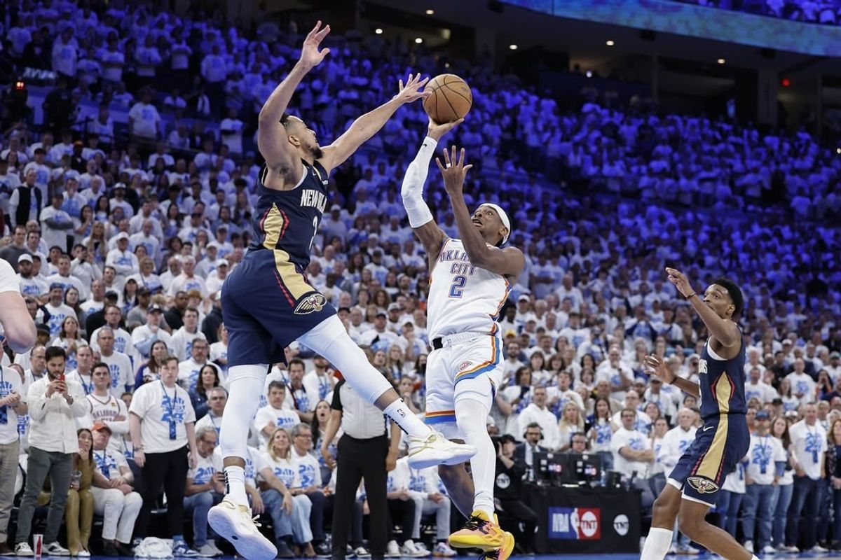 Apr 21, 2024; Oklahoma City, Oklahoma, USA; Oklahoma City Thunder guard Shai Gilgeous-Alexander (2) shoots as New Orleans Pelicans guard CJ McCollum (3) defends during the fourth quarter of game one of the first round for the 2024 NBA playoffs at Paycom Center.