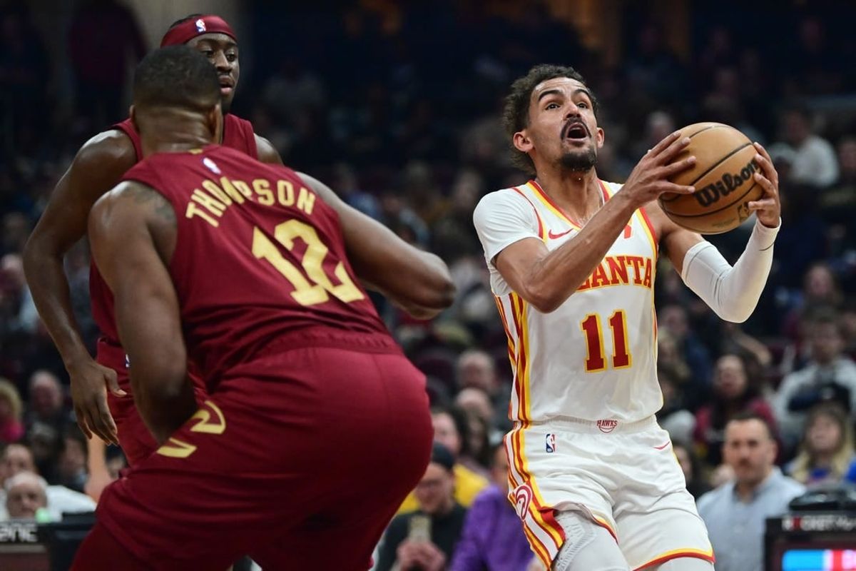 Dec 16, 2023; Cleveland, Ohio, USA; Atlanta Hawks guard Trae Young (11) drives to the basket against the Cleveland Cavaliers during the first half at Rocket Mortgage FieldHouse.