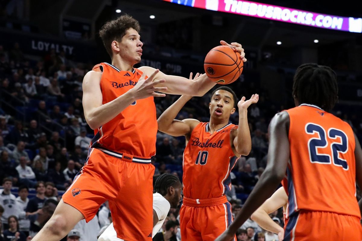 Dec 2, 2023; University Park, Pennsylvania, USA; Bucknell Bison center Noah Williamson (3) grabs a rebound against the Penn State Nittany Lions during the first half at Bryce Jordan Center. Bucknell won 76-67. Mandatory Credit: Matthew O'Haren-Imagn Images