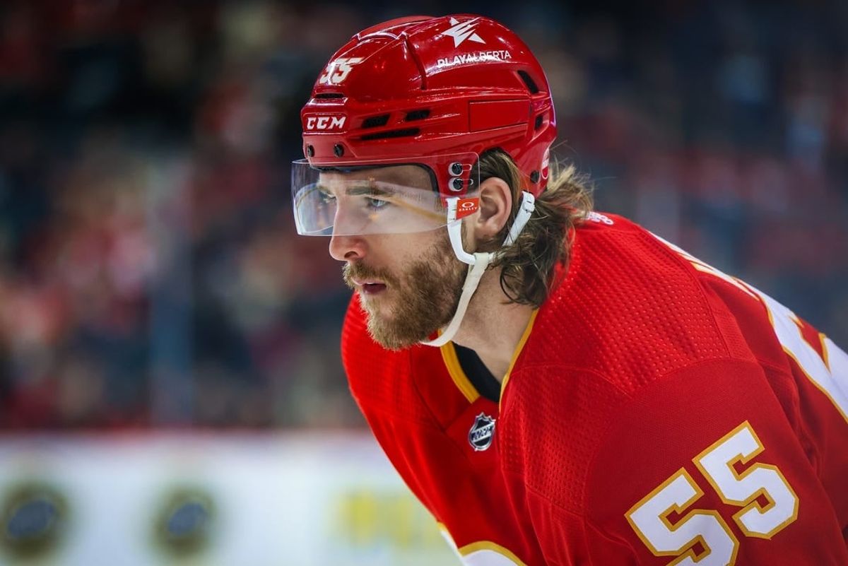 Mar 4, 2024; Calgary, Alberta, CAN; Calgary Flames defenseman Noah Hanifin (55) against the Seattle Kraken during the second period at Scotiabank Saddledome.