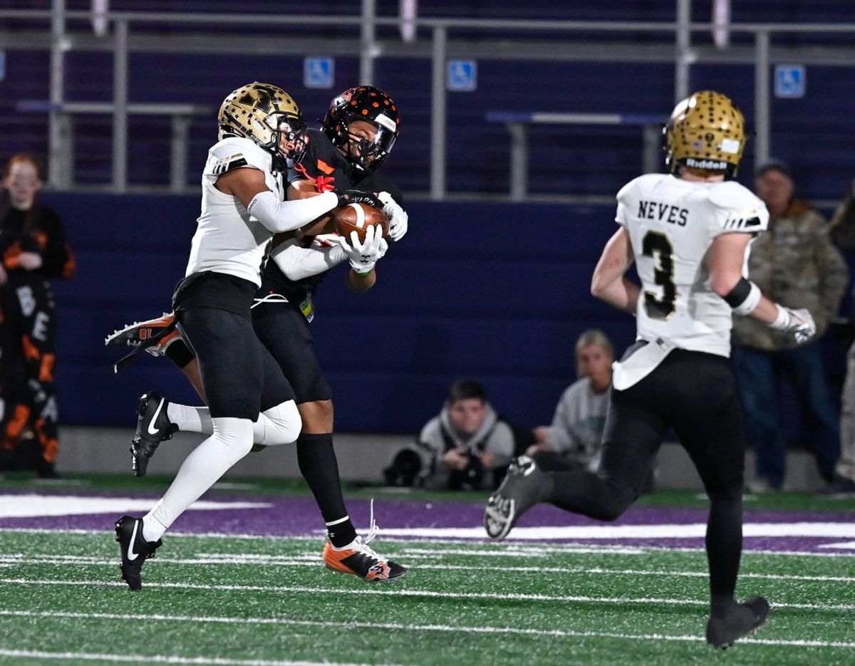 Abilene High defensive back DeMarco Upshaw intercepts a pass meant for Aledo wide receiver Kaydon Finley during Friday   s Region I-5A Div. I final in Stephenville Dec. 1, 2023. Final score was 56-21, Aledo.
