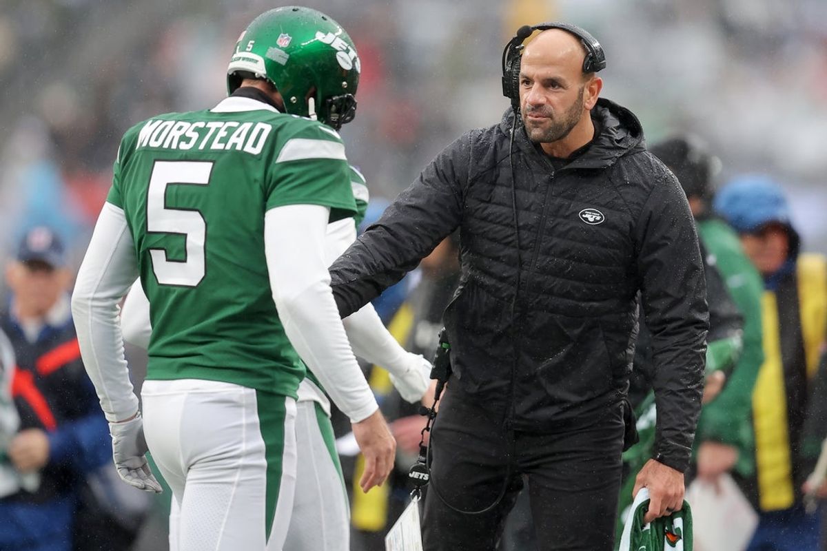 Dec 3, 2023; East Rutherford, New Jersey, USA; New York Jets head coach Robert Saleh greets punter Thomas Morstead (5) as he returns to the sideline after a punt against the Atlanta Falcons during the first quarter at MetLife Stadium. Mandatory Credit: Brad Penner-Imagn Images