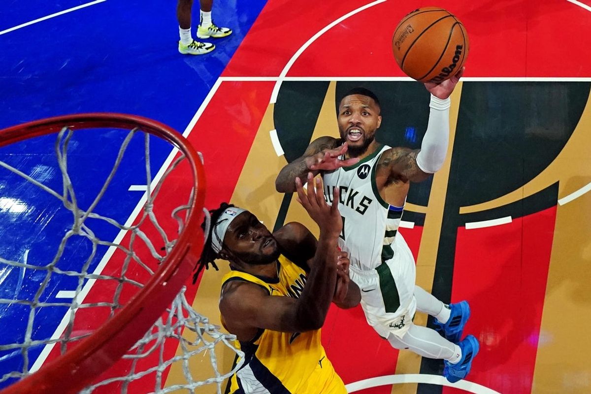 Dec 7, 2023; Las Vegas, Nevada, USA; Milwaukee Bucks guard Damian Lillard (0) shoots the ball against Indiana Pacers center Myles Turner (33) in the NBA In Season Tournament Semifinal at T-Mobile Arena. Mandatory Credit: Kyle Terada-Imagn Images