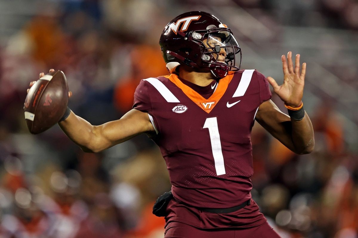 Nov 18, 2023; Blacksburg, Virginia, USA; Virginia Tech Hokies quarterback Kyron Drones (1) throws a pass against the North Carolina State Wolfpack at Lane Stadium. Mandatory Credit: Peter Casey-USA TODAY Sports